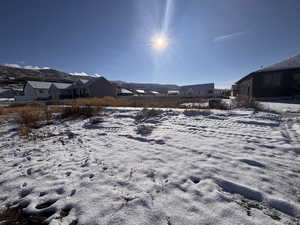 View of yard covered in snow