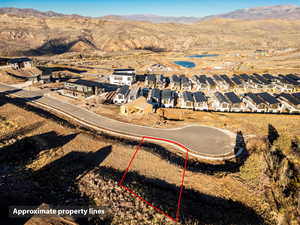 Aerial perspective of suburban area featuring a mountain backdrop