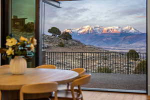 Dining through nano doors to outdoor living space.