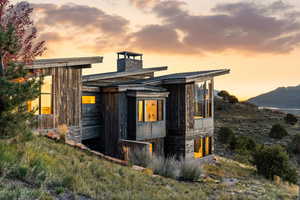 View of property exterior with a chimney