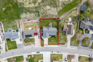 Aerial perspective of suburban area featuring property parcel outlined