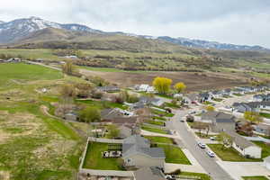 Aerial perspective of suburban area featuring a mountain backdrop