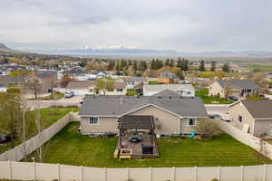 Aerial perspective of suburban area with a mountain backdrop