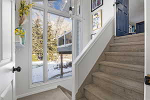 Staircase to garage and additional laundry room.