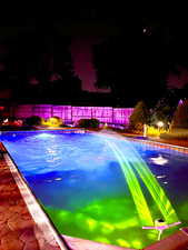 View of pool at night