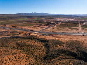 View of mountain backdrop with rural landscape and a desert landscape