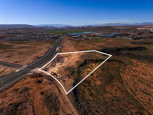 Aerial view of property's location with property parcel outlined and a water and mountain view