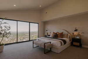 Carpeted bedroom with high vaulted ceiling