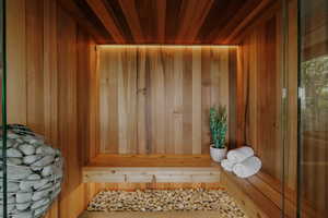 Sauna / steam room with wood ceiling and wood walls