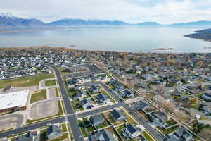 Aerial overview of property's location featuring nearby suburban area and a water and mountain view
