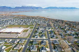 Aerial view of property's location with nearby suburban area and a water and mountain view