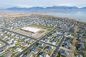 Aerial view of property's location with nearby suburban area and a water and mountain view