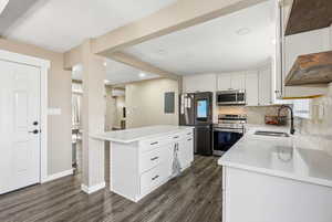 Overview of the custom kitchen with wonderful two tone paint-easy access to the garage & plenty of living space!