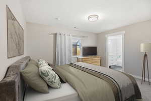 Bedroom featuring carpet flooring and ensuite bathroom