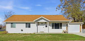 A charming farmhouse look with a wonderful backyard and plenty of upgrades on the inside.