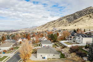 Aerial view of residential area featuring a mountain backdrop