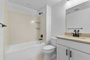 Bathroom with vanity and shower / bathtub combination