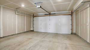 Garage featuring a garage door opener