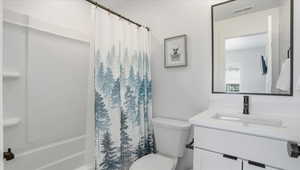 Full bathroom with vanity and shower / bath combo