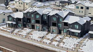 Snowy aerial view with a residential view
