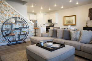Living room featuring wood finished floors and recessed lighting