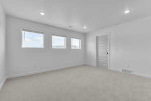 Spare room featuring carpet floors