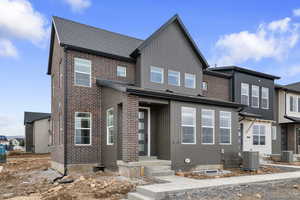 View of front facade featuring brick siding