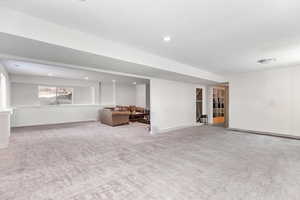 Double Family Room downstairs with walk out basement, natural lighting