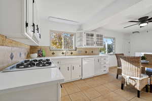Kitchen featuring white cabinets, open shelves, white appliances, and a ceiling fan