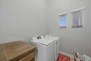 Washroom featuring separate washer and dryer