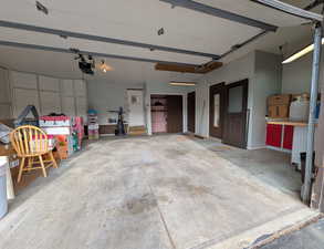 Garage featuring a garage door opener