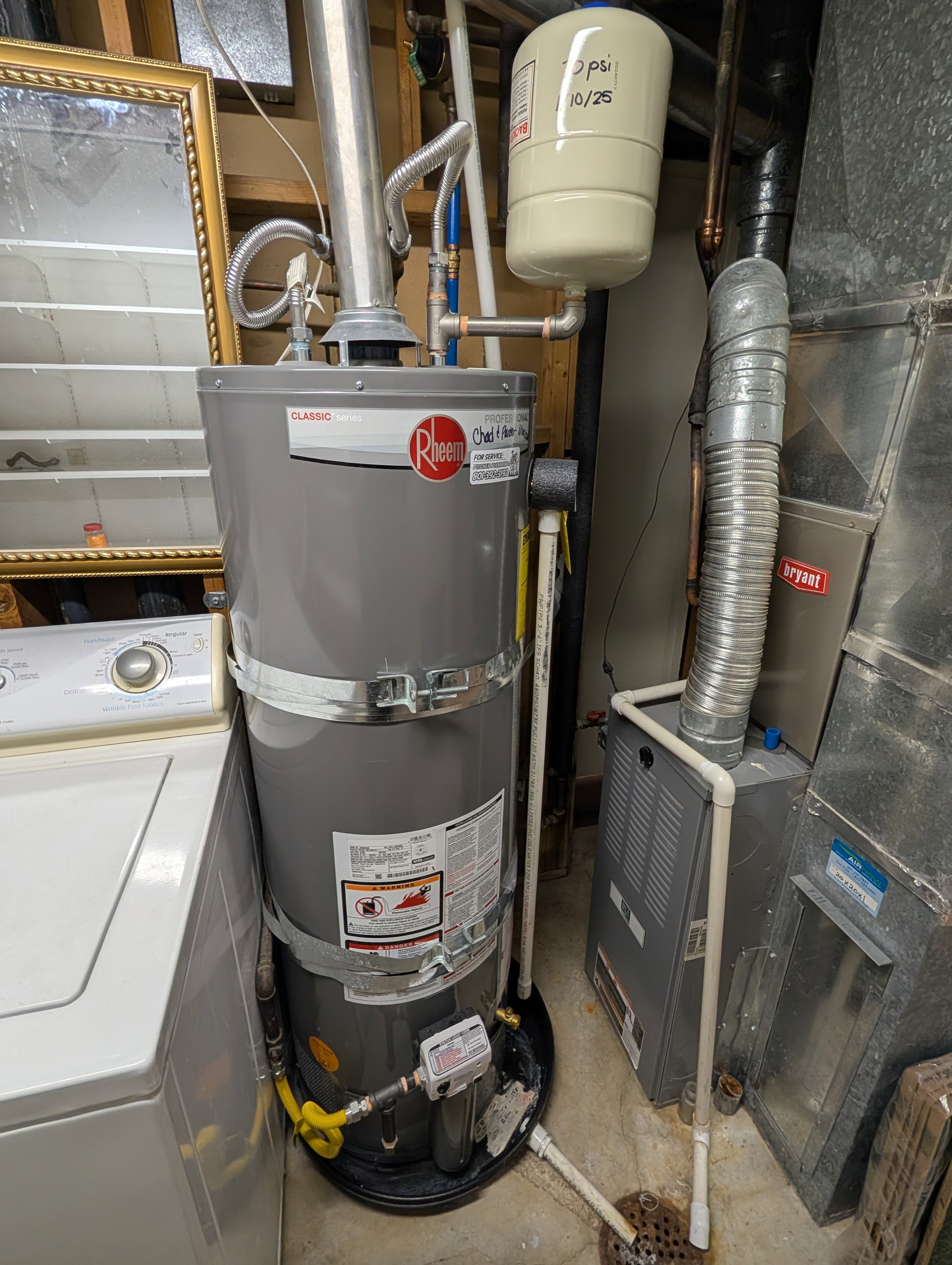Utility area featuring a water heater, expansion tank, and furnace