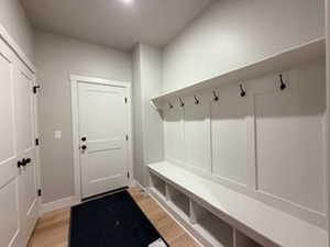 Mudroom with light wood-style flooring