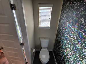Full bathroom featuring baseboards and a shower with shower curtain