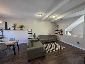 Living area with dark wood-style flooring