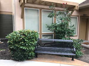 View of exterior entry with stucco siding