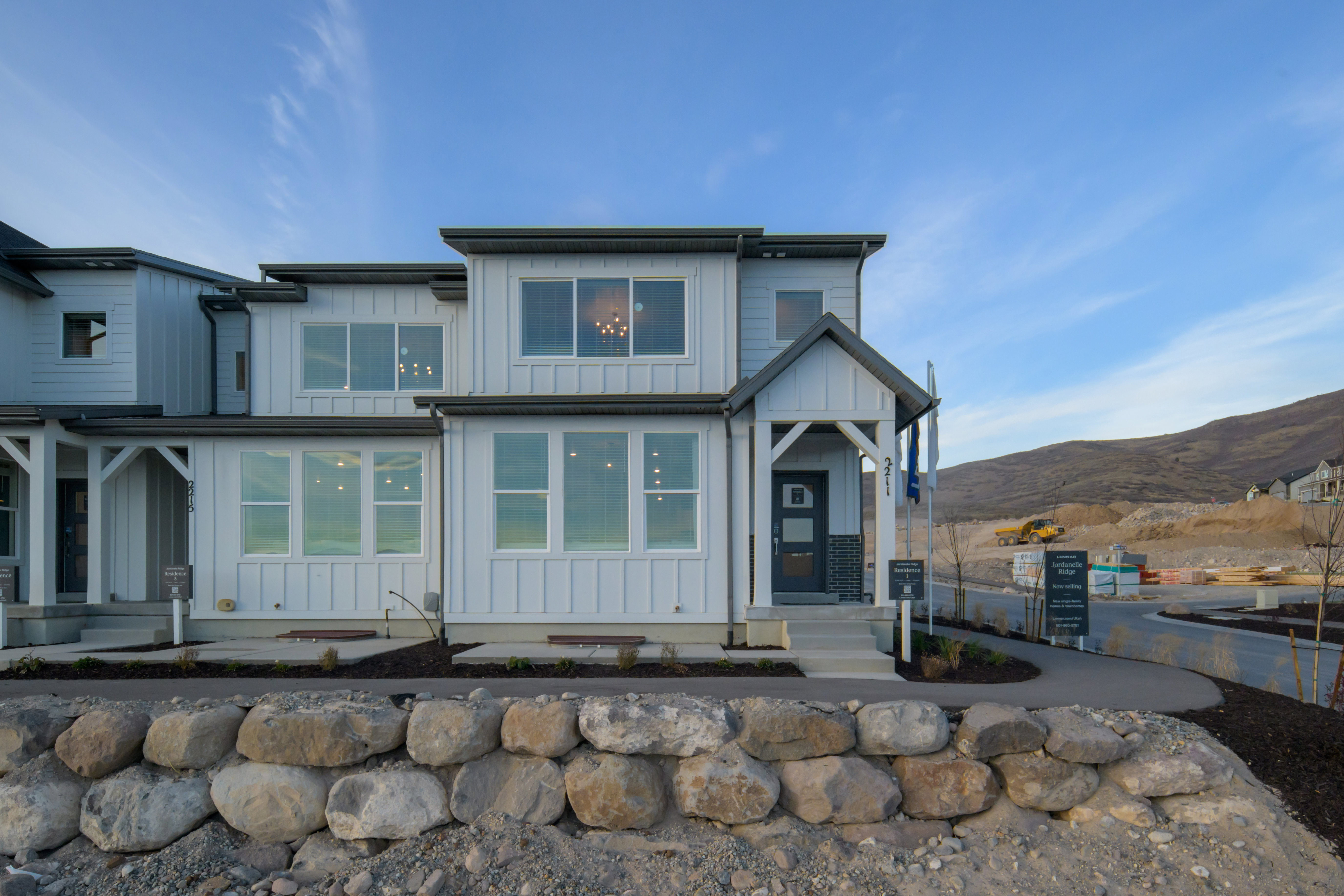 View of front of home with board and batten siding and a mountain view