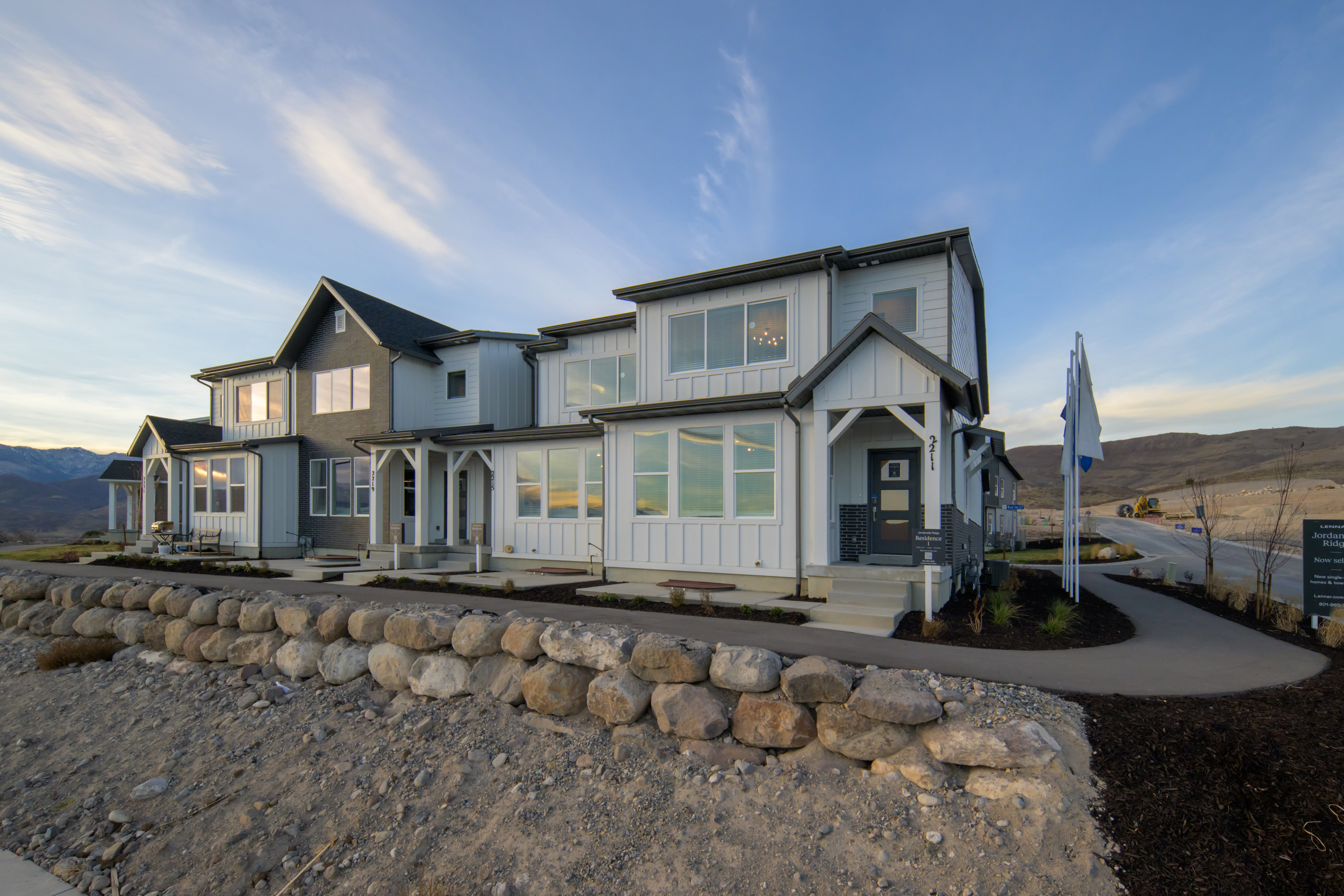 View of front of property with board and batten siding, a mountain view, and covered porch
