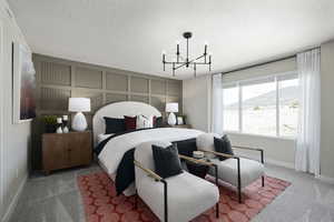 Bedroom with a textured ceiling, carpet flooring, a chandelier, and a mountain view