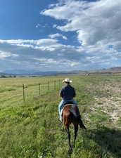 Exterior view of mountains riding the fence line