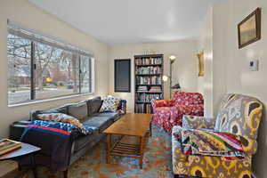 View of living area featuring large window