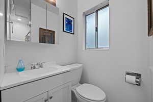 Bathroom featuring vanity and toilet
