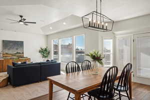 Dining space featuring ceiling fan, recessed lighting, and a chandelier