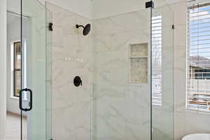 Full bathroom with a shower stall