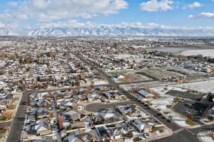 Aerial overview of property's location with nearby suburban area and mountains