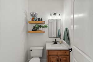 Bathroom with vanity and toilet