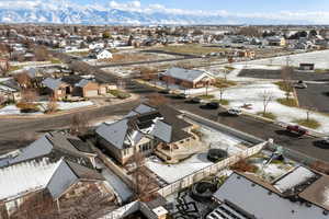 Snowy aerial view with a residential view