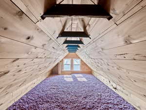 The LOFT above the garage - it was INSULATED, CARPETED, and has outlets available.