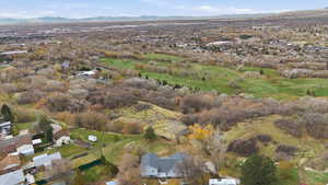 Aerial view of property's location with a mountain backdrop