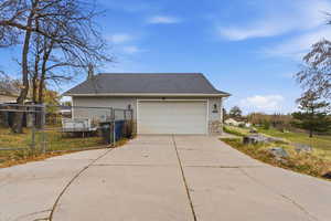 View of side of property with two car garage